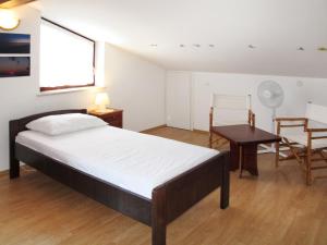 Posteľ alebo postele v izbe v ubytovaní Holiday Home Ema by Interhome