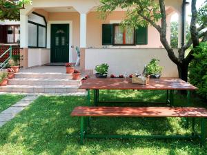 a picnic table in front of a house at Holiday Home Andrea - LBN415 by Interhome in Labin