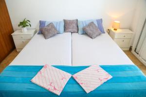 Posteľ alebo postele v izbe v ubytovaní Apartments Butkovic