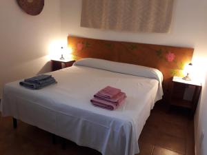 A bed or beds in a room at Canne Al Vento