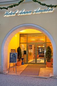 an archway in front of a building with a sign at Hotel Anna Amalia in Weimar