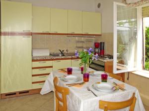 a kitchen with a table with plates on it at Apartment Hela - LOV512 by Interhome in Opatija