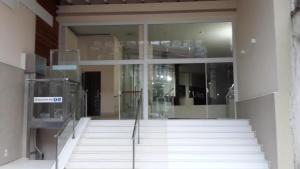 a glass building with stairs in front of it at Casablanca Center Hotel in Petrópolis