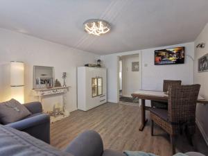a living room with a table and a couch at FeWo Hage in Langelsheim