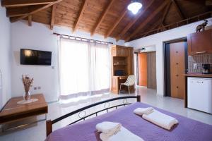 A bed or beds in a room at Vasso Apartments 3