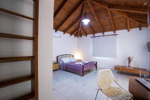 A bed or beds in a room at Vasso Apartments 3