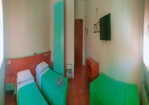 A bed or beds in a room at Albergo Acampora