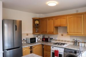 Η κουζίνα ή μικρή κουζίνα στο Cosy & Spacious 5 bedroom Luxurious Home