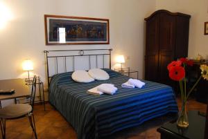 Postel nebo postele na pokoji v ubytování B&B Corte Barocca