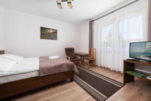 TV a/nebo společenská místnost v ubytování Baltic House