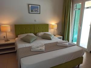 Postel nebo postele na pokoji v ubytování Villa Lilly