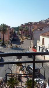 a view from a balcony of a street with a parking lot at Appartamento Risoli GP in Scalea