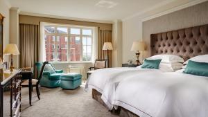 a hotel room with a large bed and a window at InterContinental Dublin, an IHG Hotel in Dublin