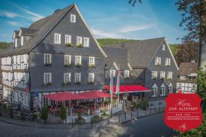 a rendering of a rendering of a building in a town at Hotel zur Altstadt in Freudenberg