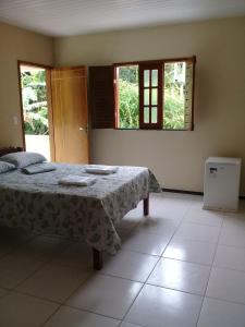 Katil atau katil-katil dalam bilik di HOTEL CANTINHO DAS FLORES
