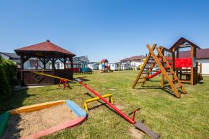 a group of playground equipment in a yard at Rowyhills in Rowy +16 photos
