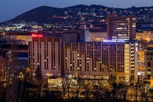 a view of a city skyline at night at ibis Budapest Castle Hill in Budapest