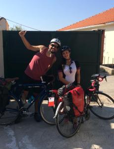 a man and a woman standing next to their bikes at Hostel & Private Rooms Dalmatia in Marusici  +110 photos