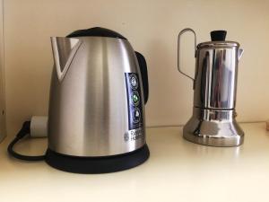 a silver tea kettle and a blender on a counter at SAY YES MILANO CITY LIFE in Milan