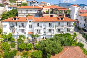 an aerial view of a large white building with orange roofs at Agnandi in Neos Marmaras