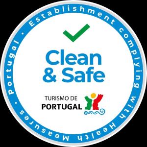 a blue and white clean and safe logo at Guest House Porto Clerigus in Porto