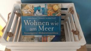 a book sitting on top of a book shelf at DerOstseegast in Heiligenhafen