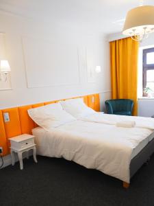 Łóżko lub łóżka w pokoju w obiekcie Apartamenty Stary Browar Oleśnica