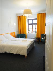 Łóżko lub łóżka w pokoju w obiekcie Apartamenty Stary Browar Oleśnica