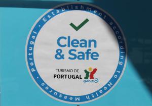 a sign for a clean and safe tulson dc portal at Hotel do Cerrado in Lamego