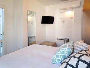 A bed or beds in a room at Broz Hostel