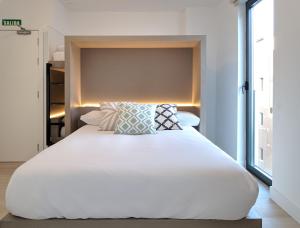 A bed or beds in a room at Broz Hostel