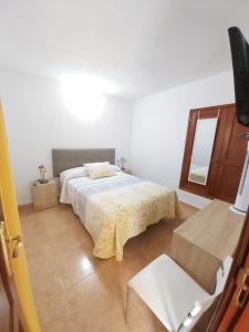 Ein Bett oder Betten in einem Zimmer der Unterkunft La casita de Candida