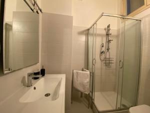 a bathroom with a sink and a shower at Centralissimo Pescara in Pescara