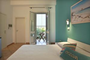 Posteľ alebo postele v izbe v ubytovaní B&B Happy Days Golfo di Gallipoli
