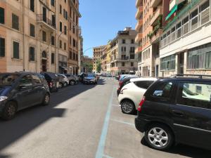 a bunch of cars parked on the side of a street at Domus Re Di Roma in Rome