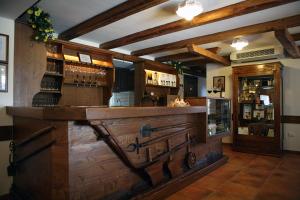 a bar with a wooden counter in a room at Agriturismo La Rosta in Cervignano del Friuli