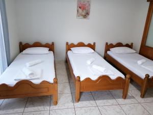 A bed or beds in a room at 85 sqm Apartments New Panorama ELECTRIC CAR ΦΩΡΤΗΣΗΣ STATION