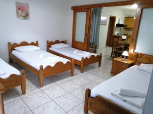 A bed or beds in a room at 85 sqm Apartments New Panorama ELECTRIC CAR ΦΩΡΤΗΣΗΣ STATION