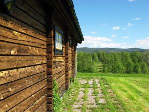 a wooden building with a window on the side of it at Chalet Vemhån Byn - HJD062 by Interhome in Vemhån