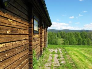 a wooden building with a window on the side of it at Chalet Vemhån Byn by Interhome in Vemhån