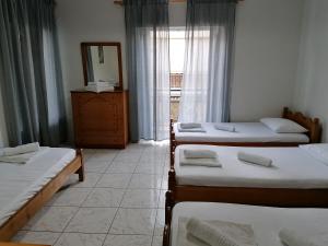 A bed or beds in a room at 85 sqm Apartments New Panorama ELECTRIC CAR ΦΩΡΤΗΣΗΣ STATION