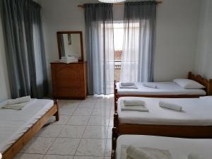 A bed or beds in a room at 85 sqm Apartments New Panorama ELECTRIC CAR ΦΩΡΤΗΣΗΣ STATION