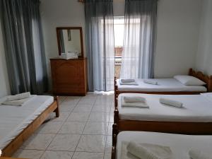 A bed or beds in a room at 85 sqm Apartments New Panorama ELECTRIC CAR ΦΩΡΤΗΣΗΣ STATION
