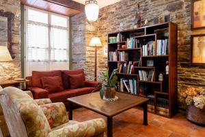 a living room with a couch and a table at Hotel Casa Soto in Vegadeo