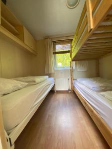 Krevet ili kreveti na kat u jedinici u objektu Vakantiehuis Veluwe Wageningen
