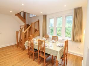a dining room with a table and chairs at School House in Ivybridge