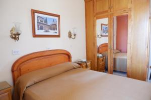 Postel nebo postele na pokoji v ubytování Hotel Central