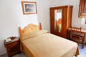 Postel nebo postele na pokoji v ubytování Hotel Central
