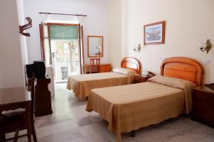 Postel nebo postele na pokoji v ubytování Hotel Central