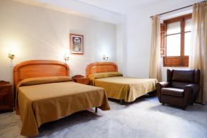 Postel nebo postele na pokoji v ubytování Hotel Central